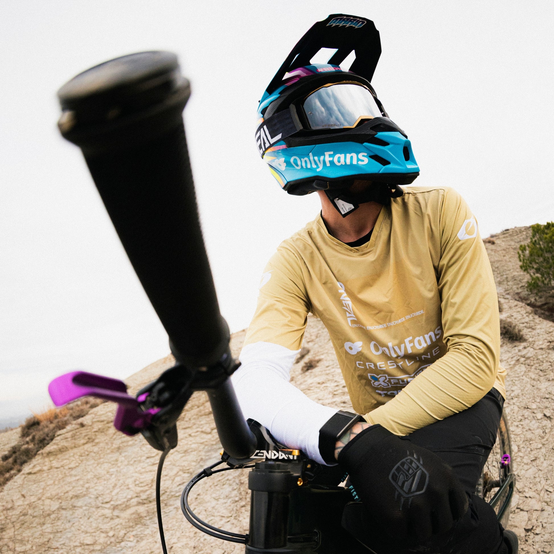Pro MTB rider Alex marin wearing brown custom jersey with custom logos
