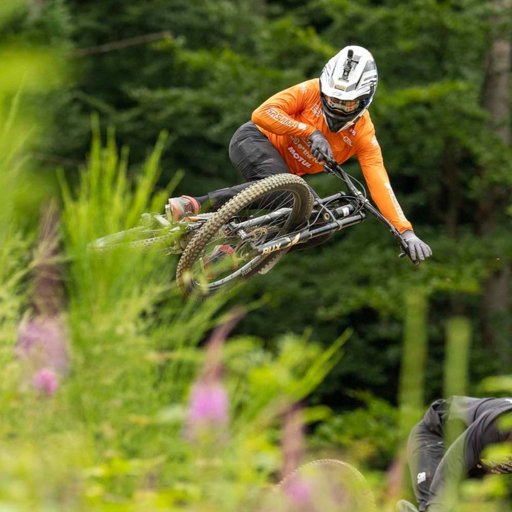 Pro DH rider Douglas Vieira wearing orange custom personalized MTB jersey